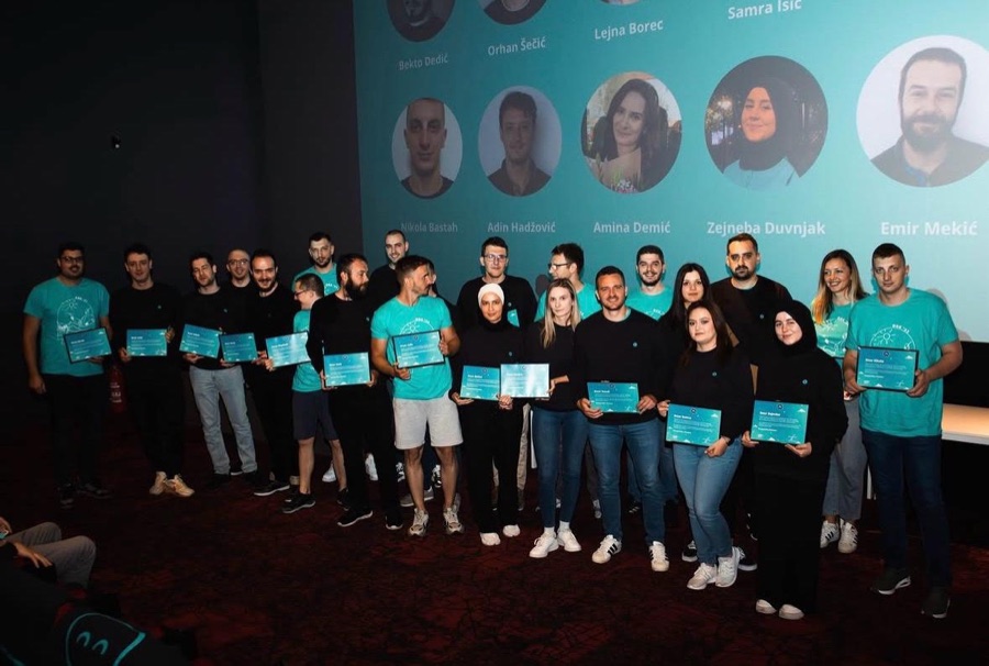 Zejneba with the team, everyone holding certificates on stage